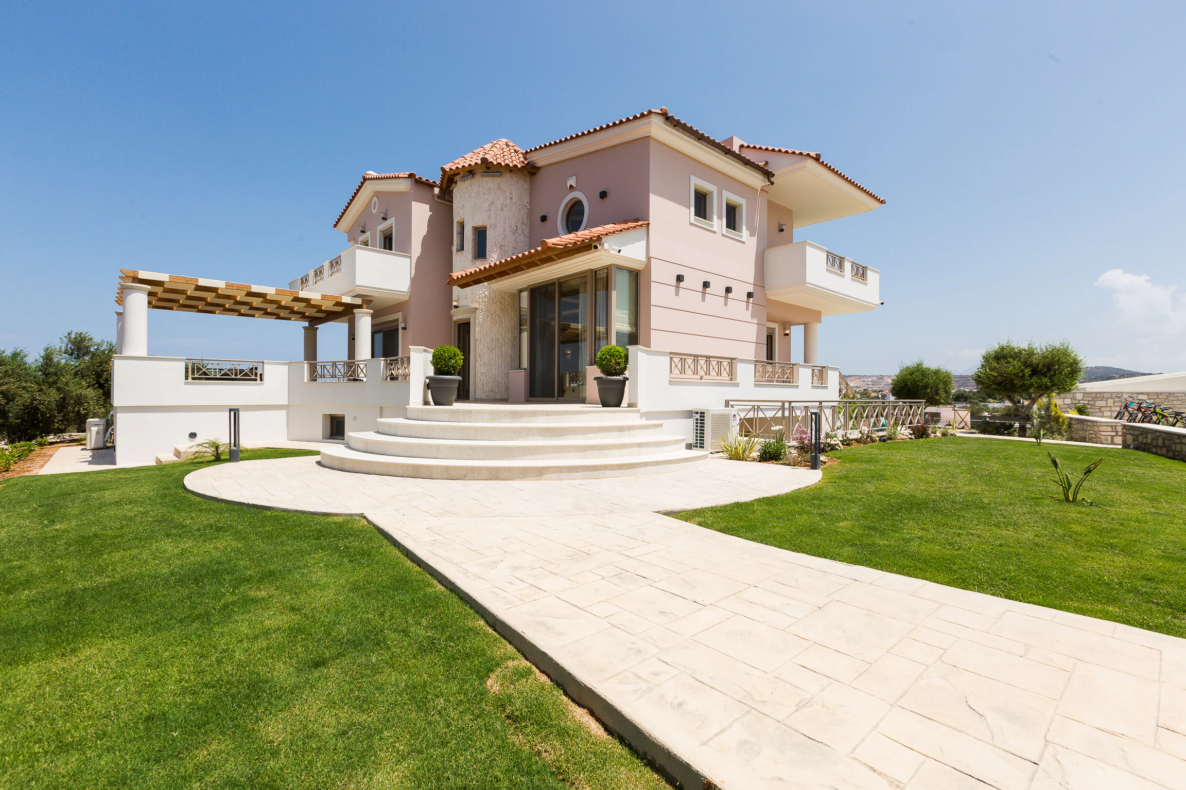 Front lawn and pale exterior of Aelia Residence