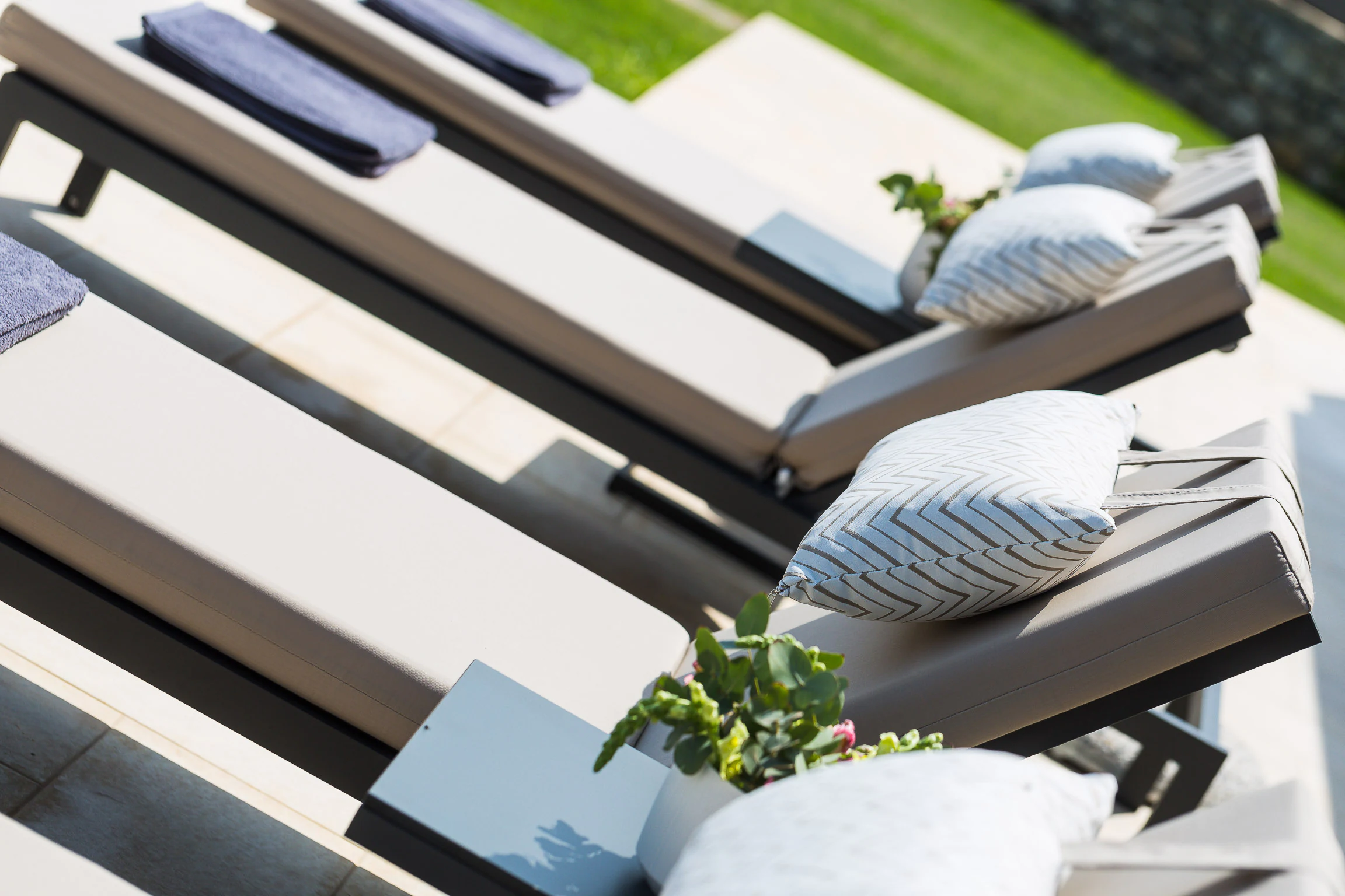 Sun loungers arranged beside the pool