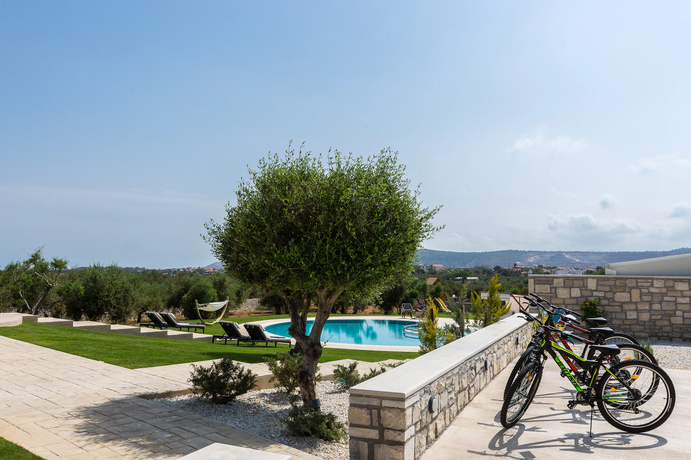 Bicycles beside the pool and lawn