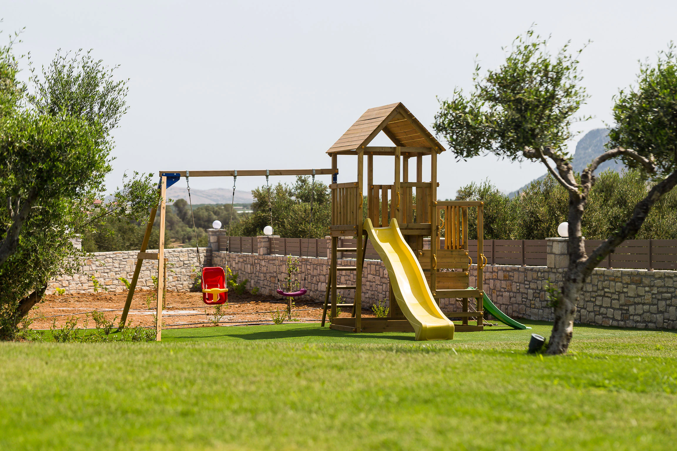 Wide view of the playground within the lawn