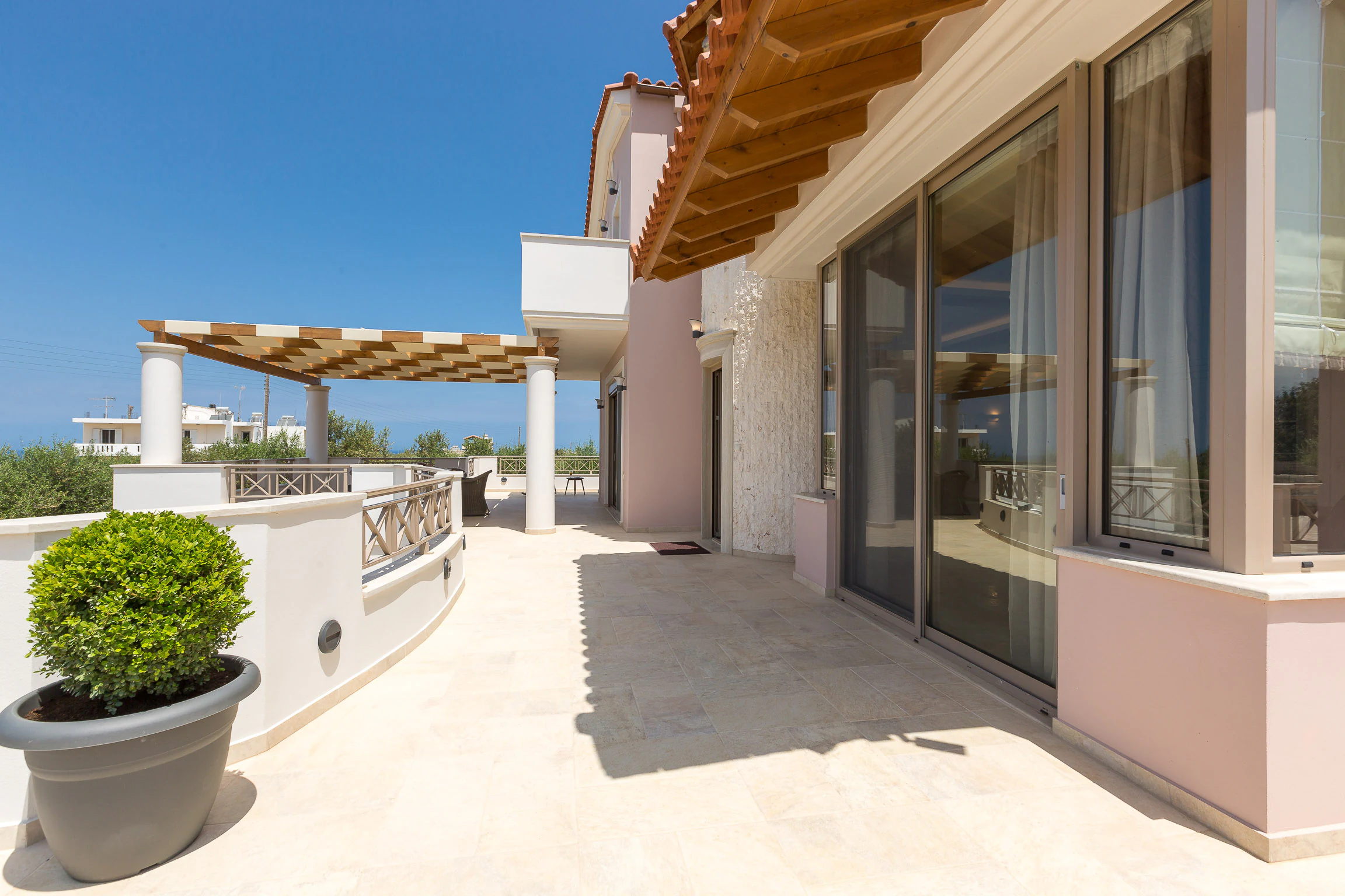 Open upper terrace walkway around the villa