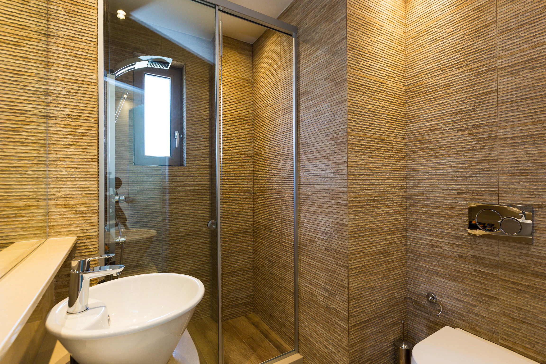 Bright bathroom with marble-patterned surfaces