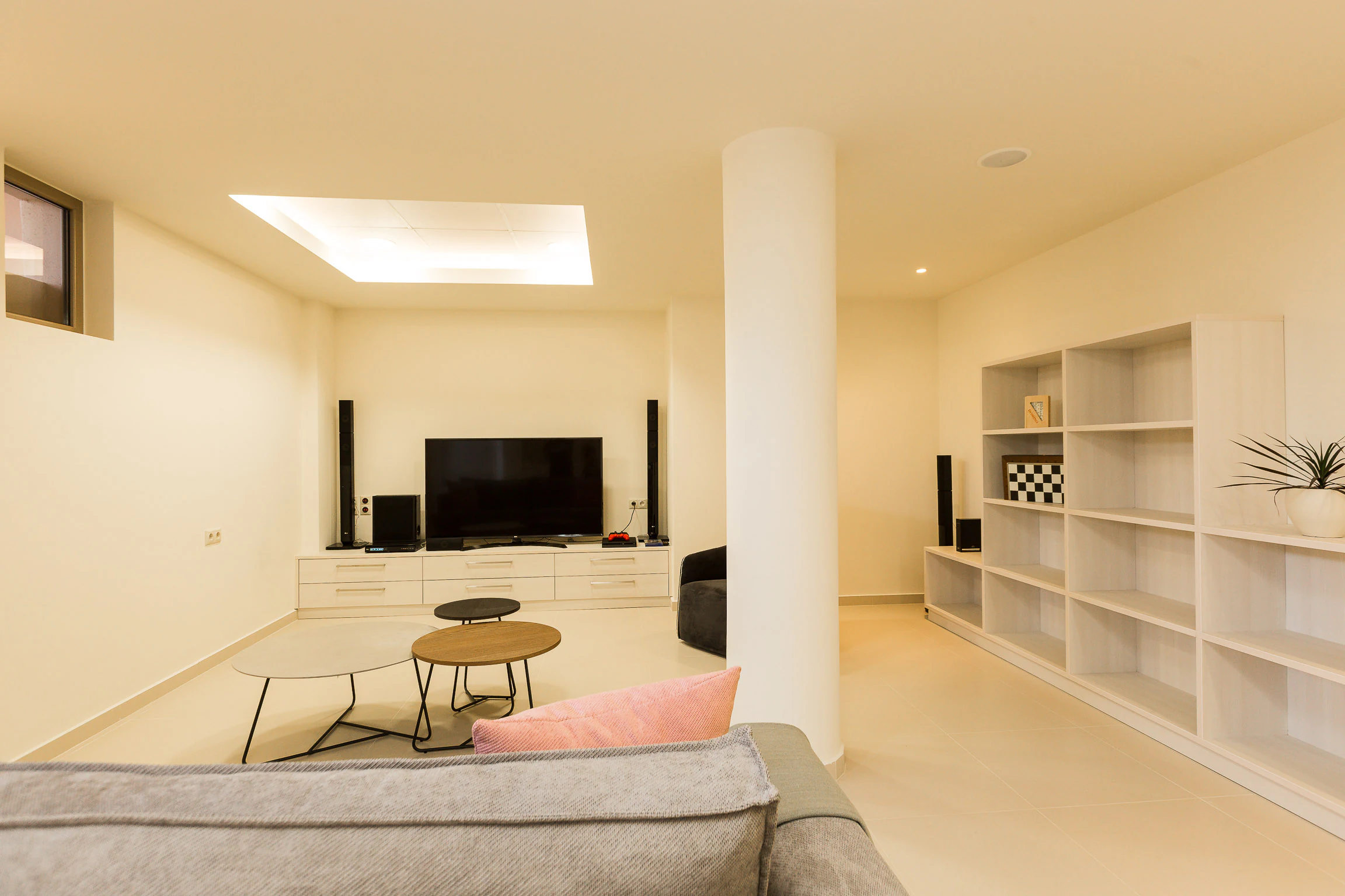 Home cinema lounge with screen and surround speakers