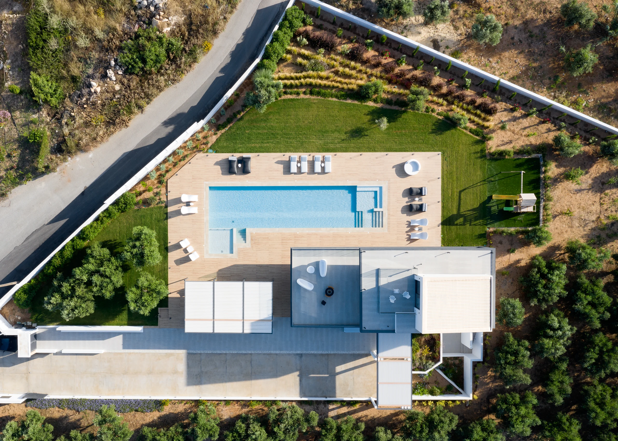 Panoramic aerial view of the villa, pools and surrounding landscape at Aesthea Exclusive Villa