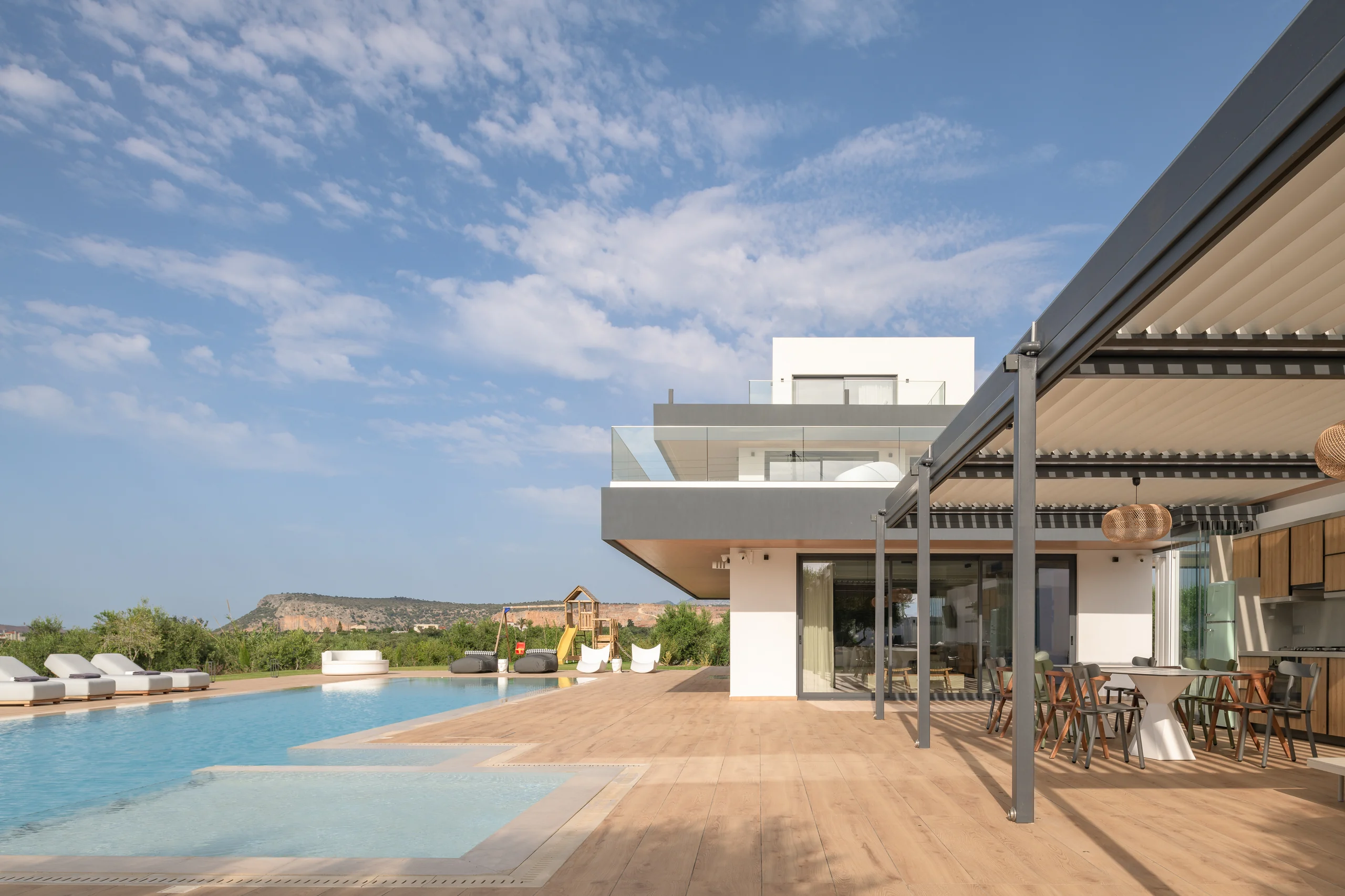 Pool pavilion and terrace as evening approaches at Aesthea Exclusive Villa