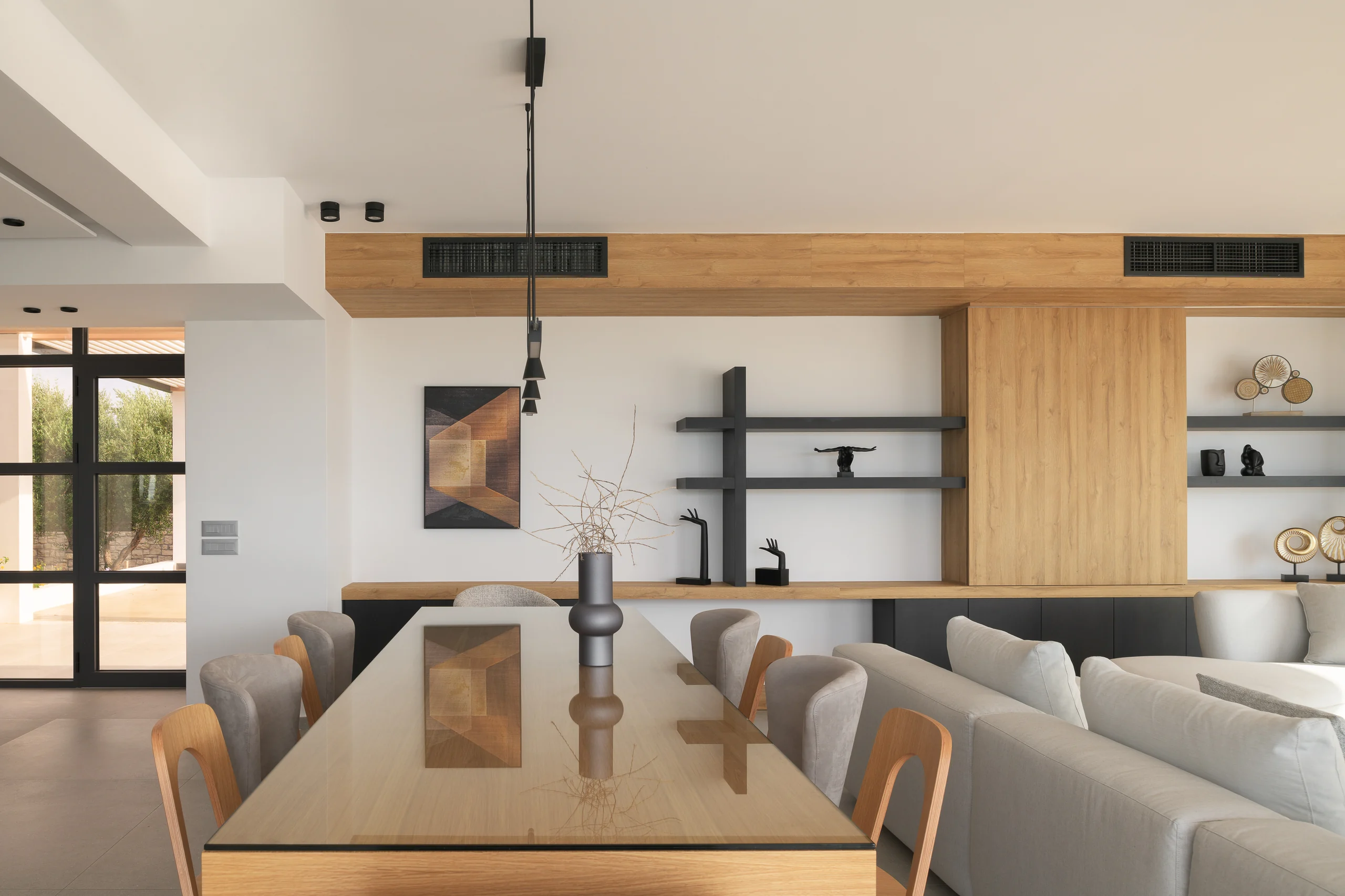Open-plan sitting, dining and kitchen spaces at Aesthea Exclusive Villa