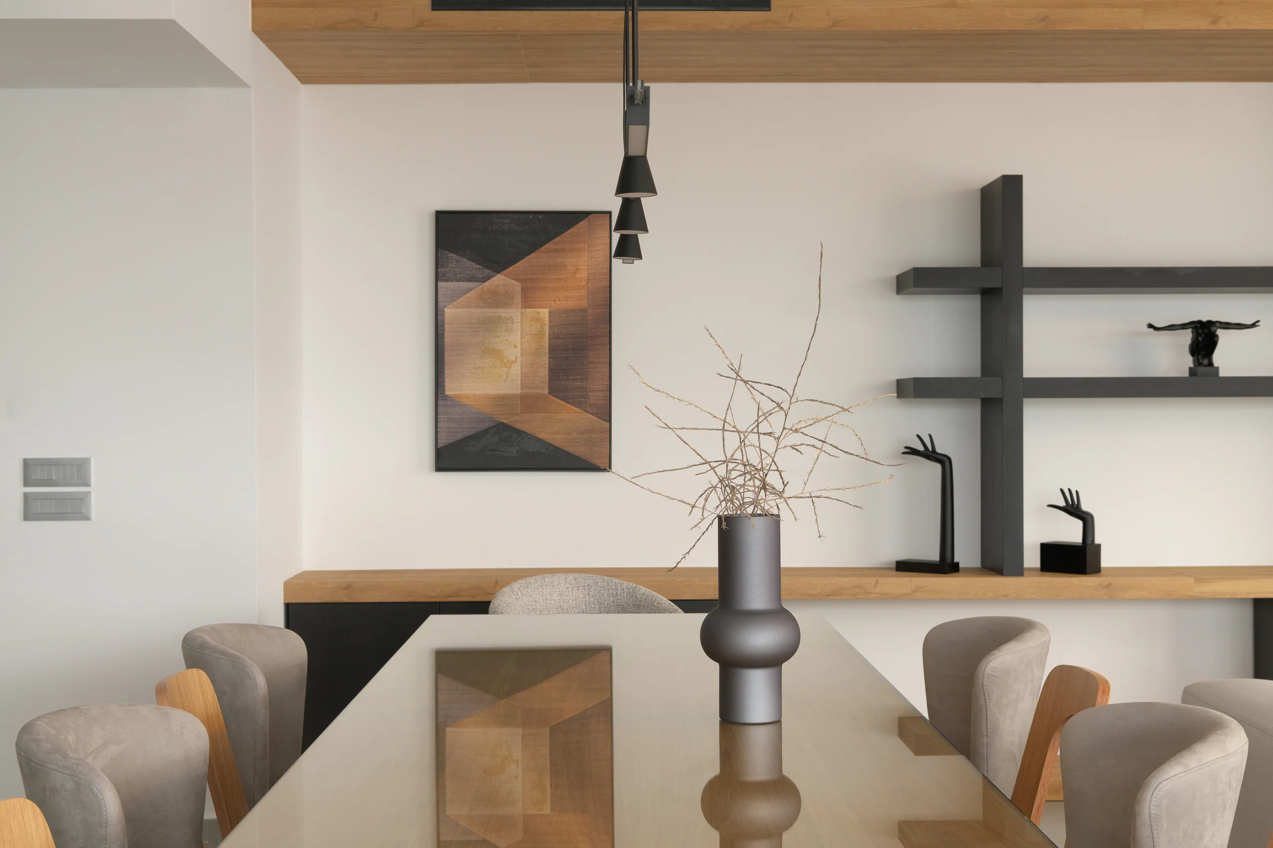 Dining table and sculptural details within the shared interior at Aesthea Exclusive Villa
