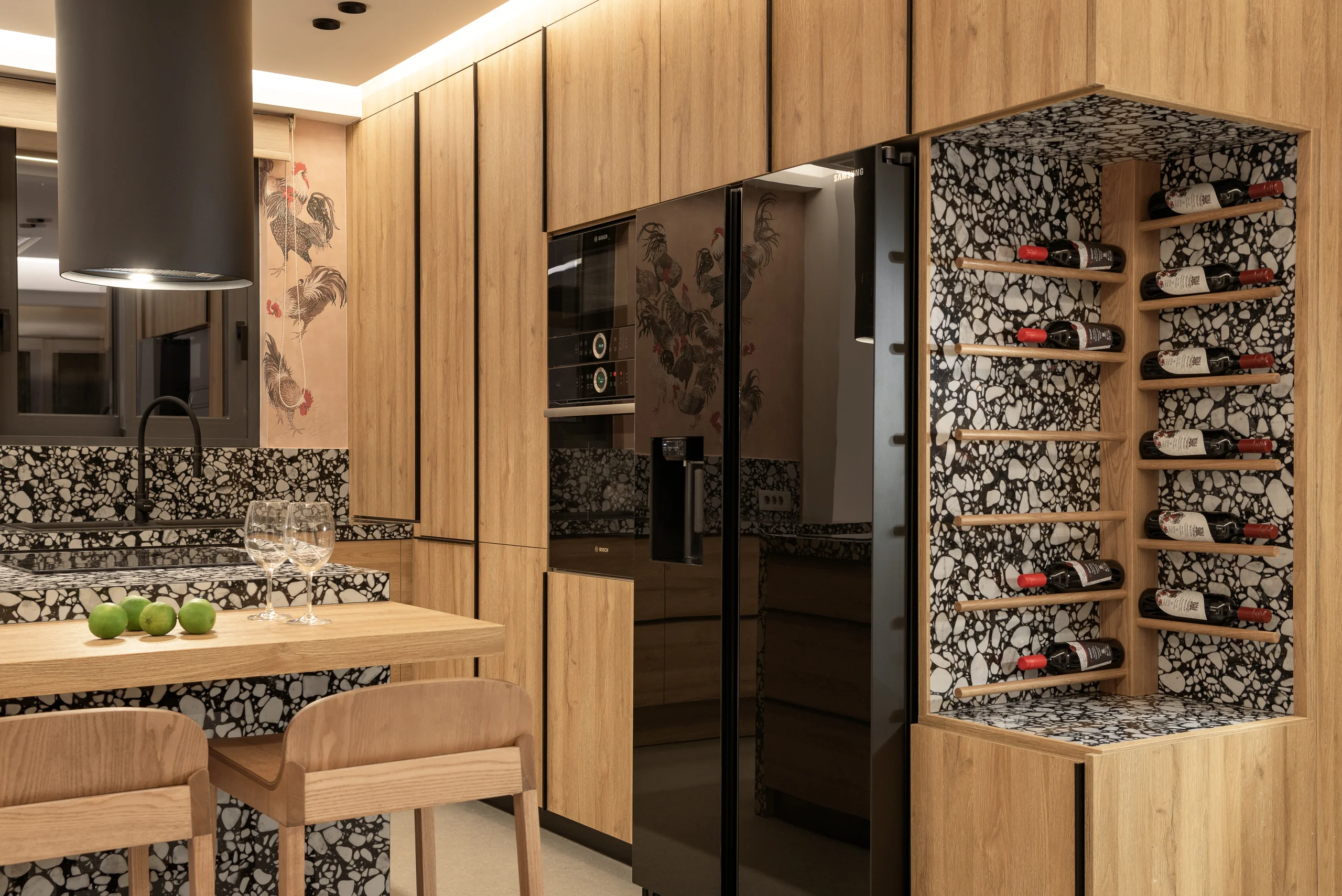 Fully equipped indoor kitchen with timber cabinetry and wine display at Aesthea Exclusive Villa