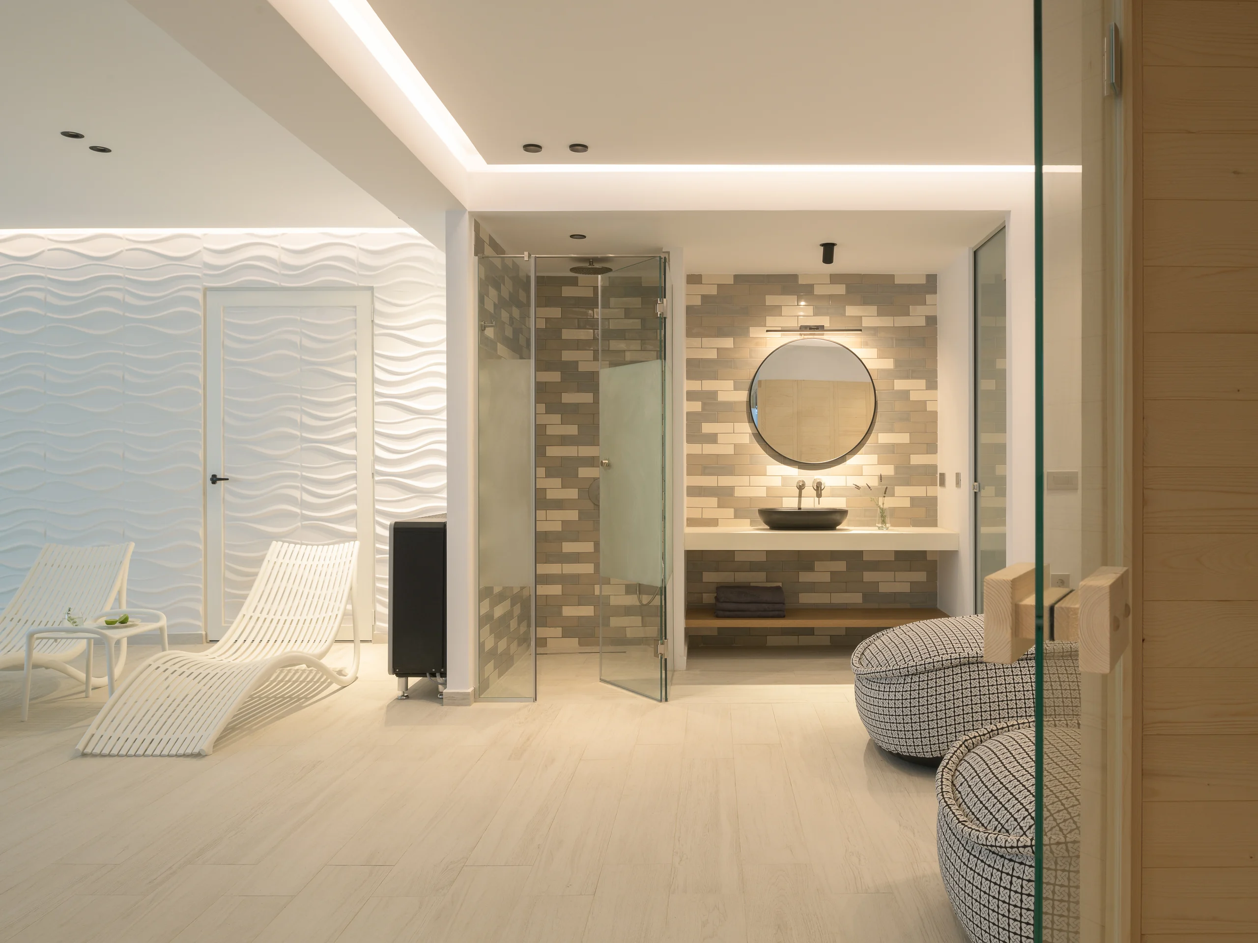 Indoor heated pool with an adjacent shower and spa lounge at Aesthea Exclusive Villa