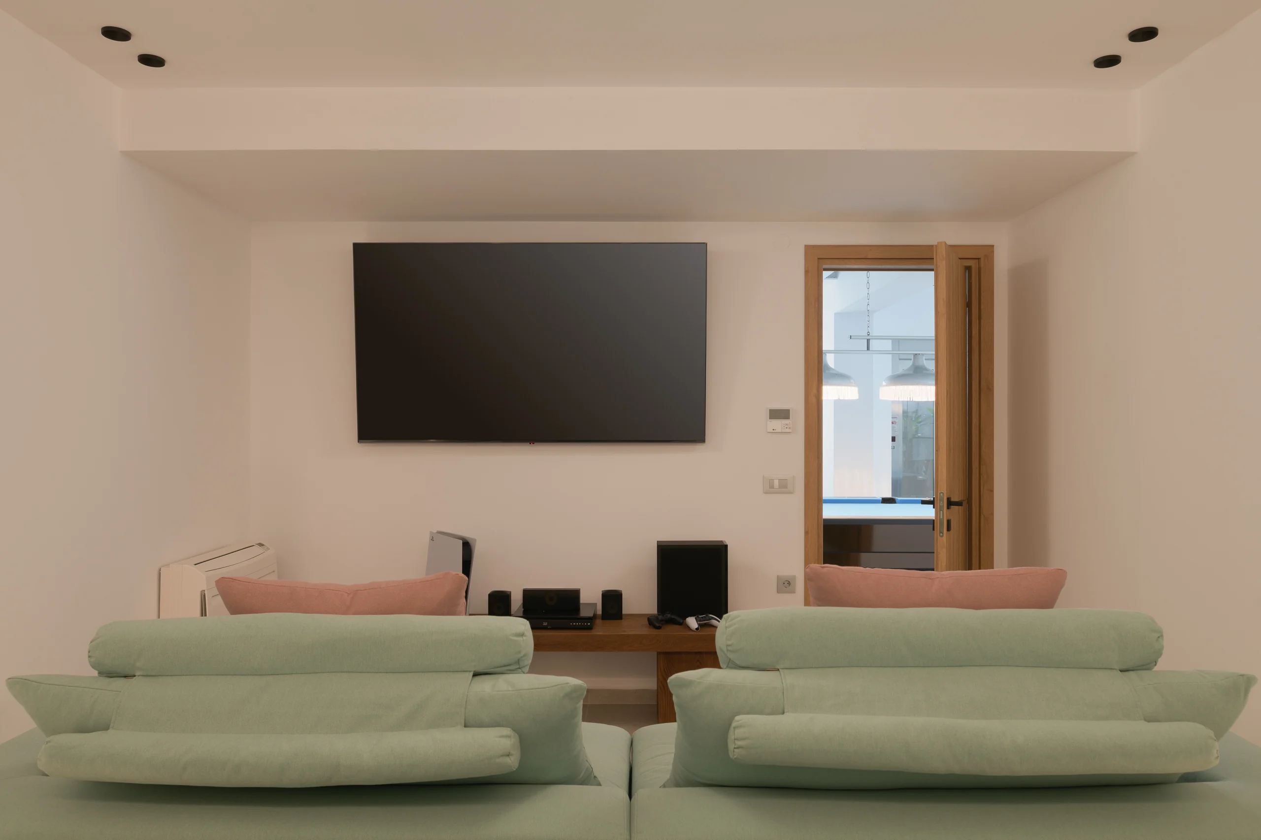 Private cinema room with tiered lounge seating at Aesthea Exclusive Villa