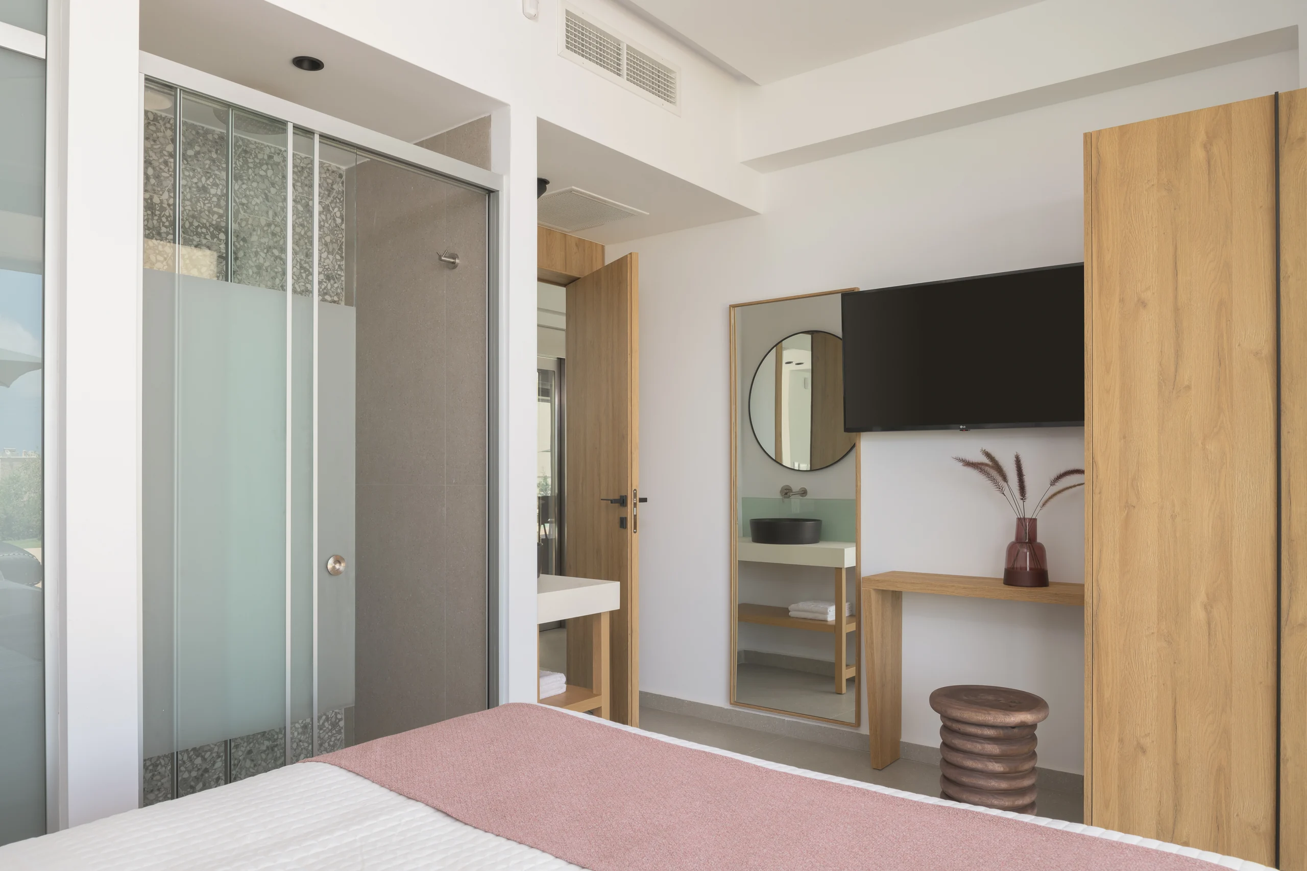 Ground-floor Bedroom 1 vanity and ensuite shower area at Aesthea Exclusive Villa