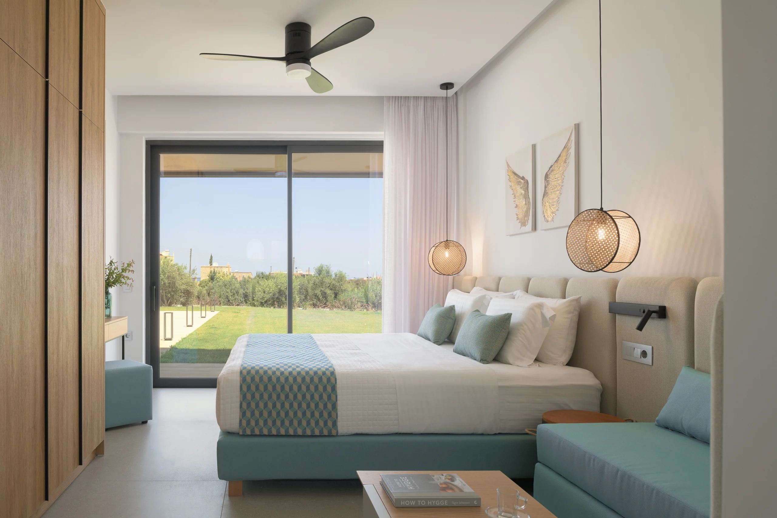Ground-floor Bedroom 2 with a queen bed and garden outlook at Aesthea Exclusive Villa