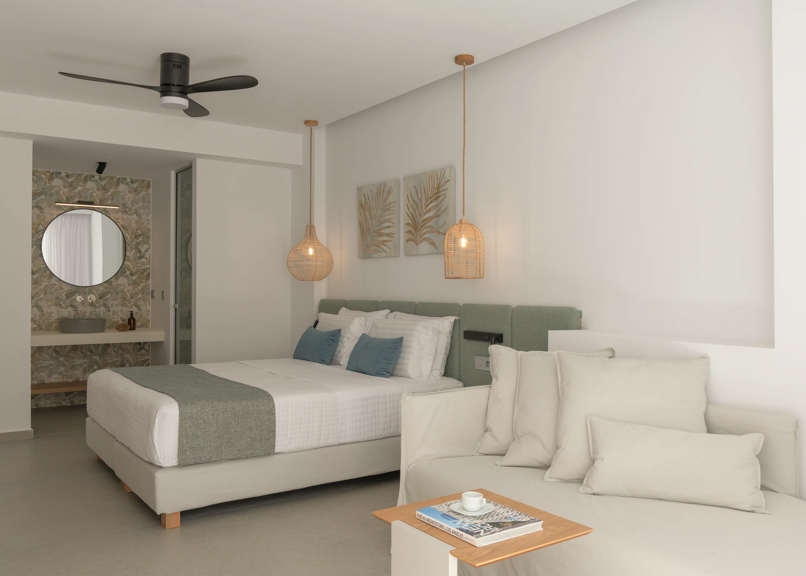 Lower-level bedroom with flexible twin-bed and sofa arrangement at Aesthea Exclusive Villa