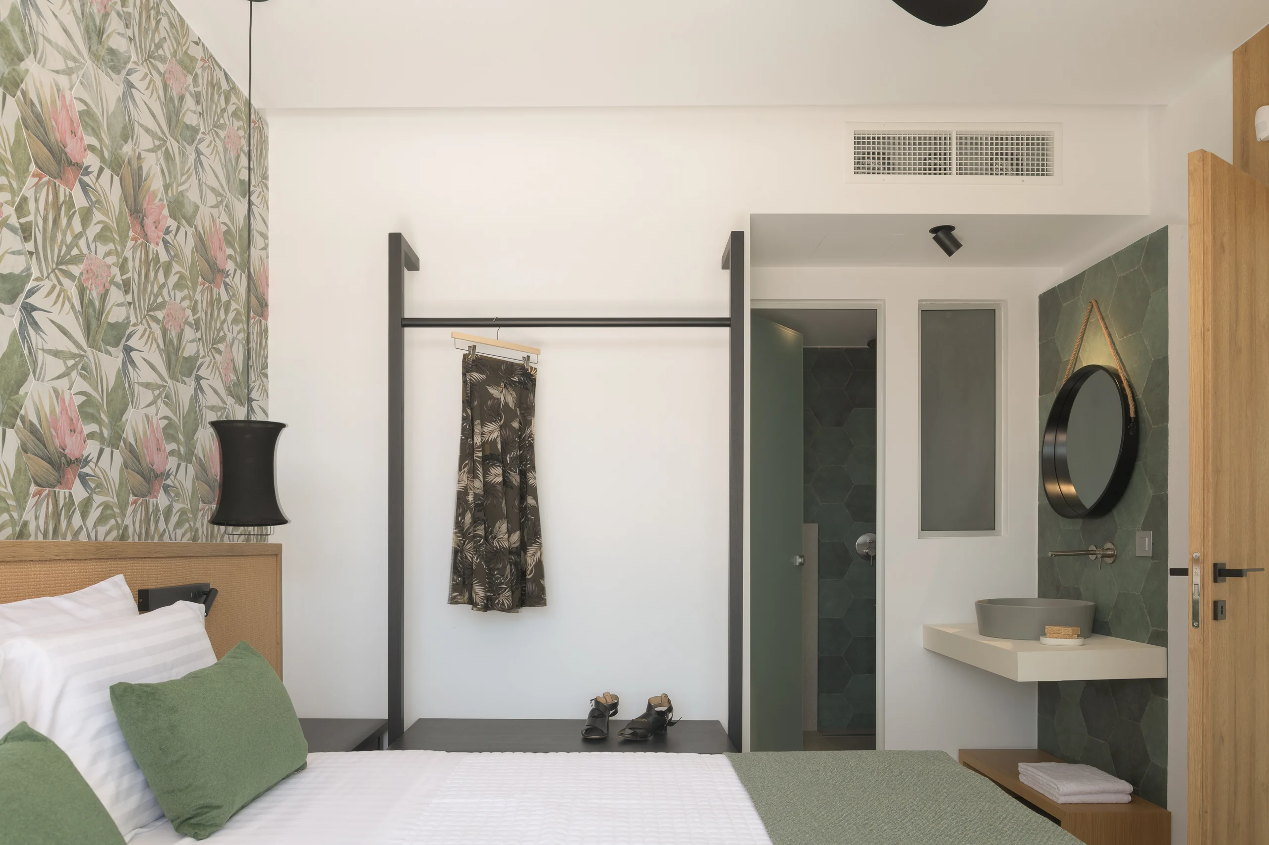 First-floor Bedroom 2 with a split-link king bed and patterned wall at Aesthea Exclusive Villa