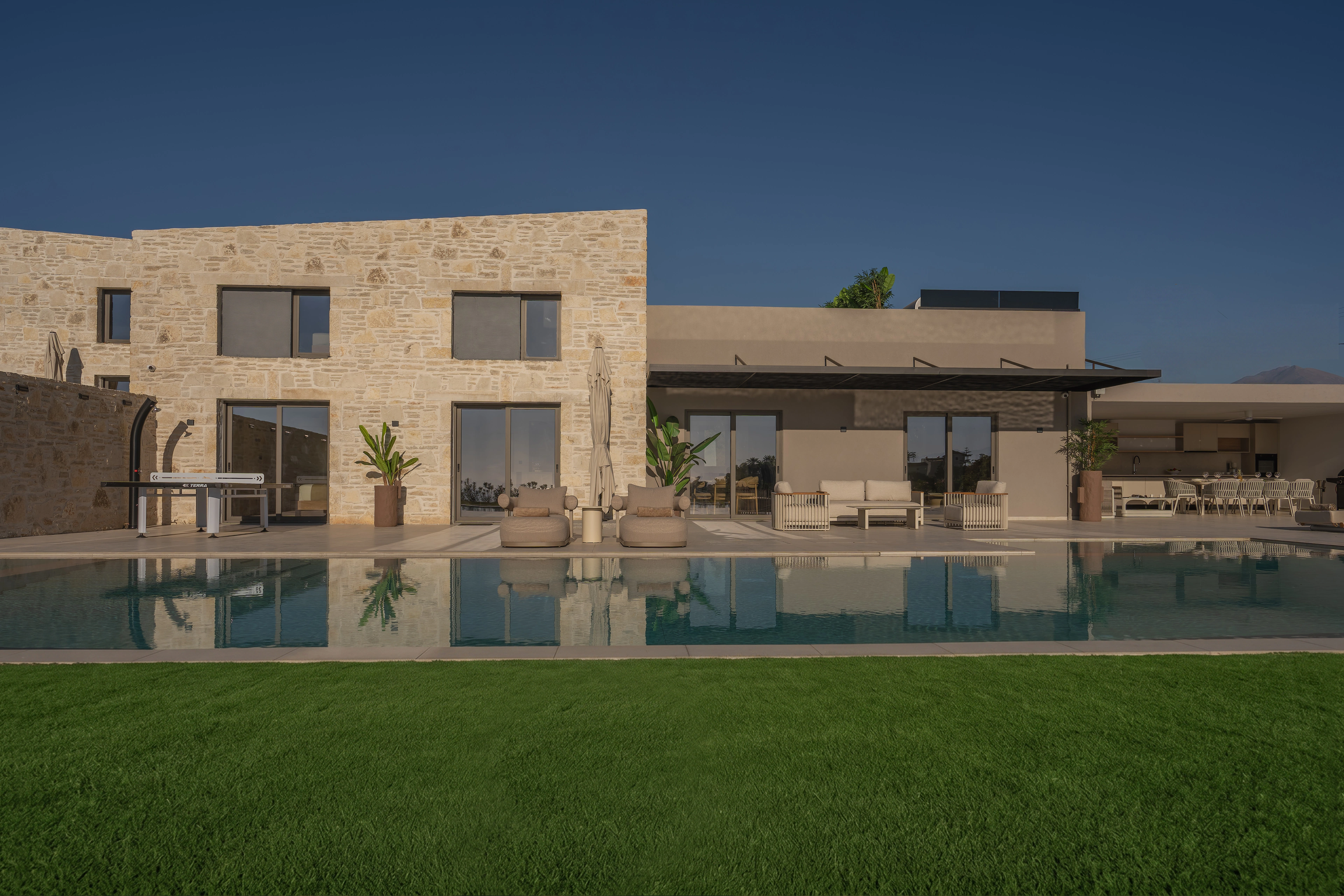 Left Crete stone facade reflected in the private pool