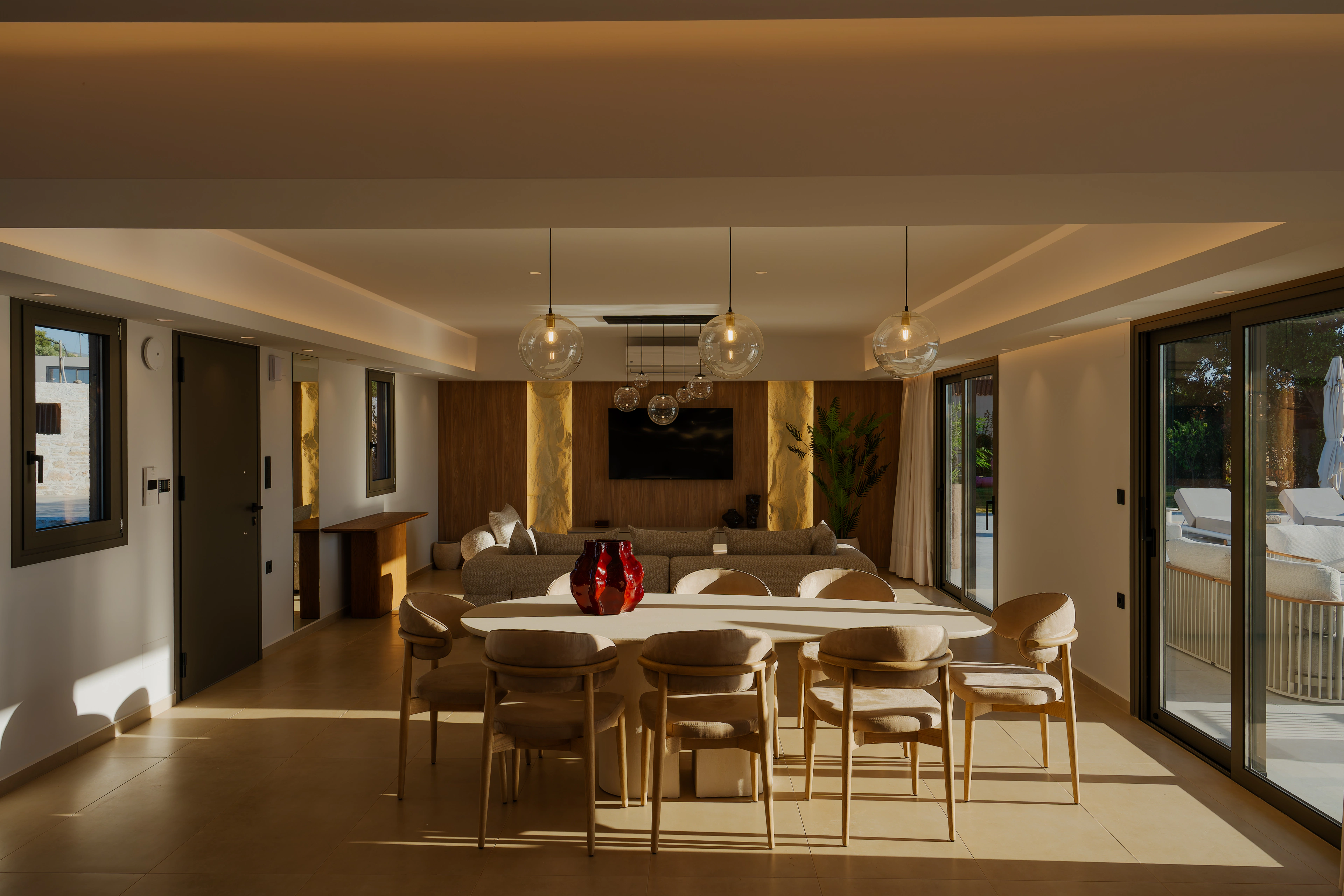 Left Crete open-plan living room in warm evening light