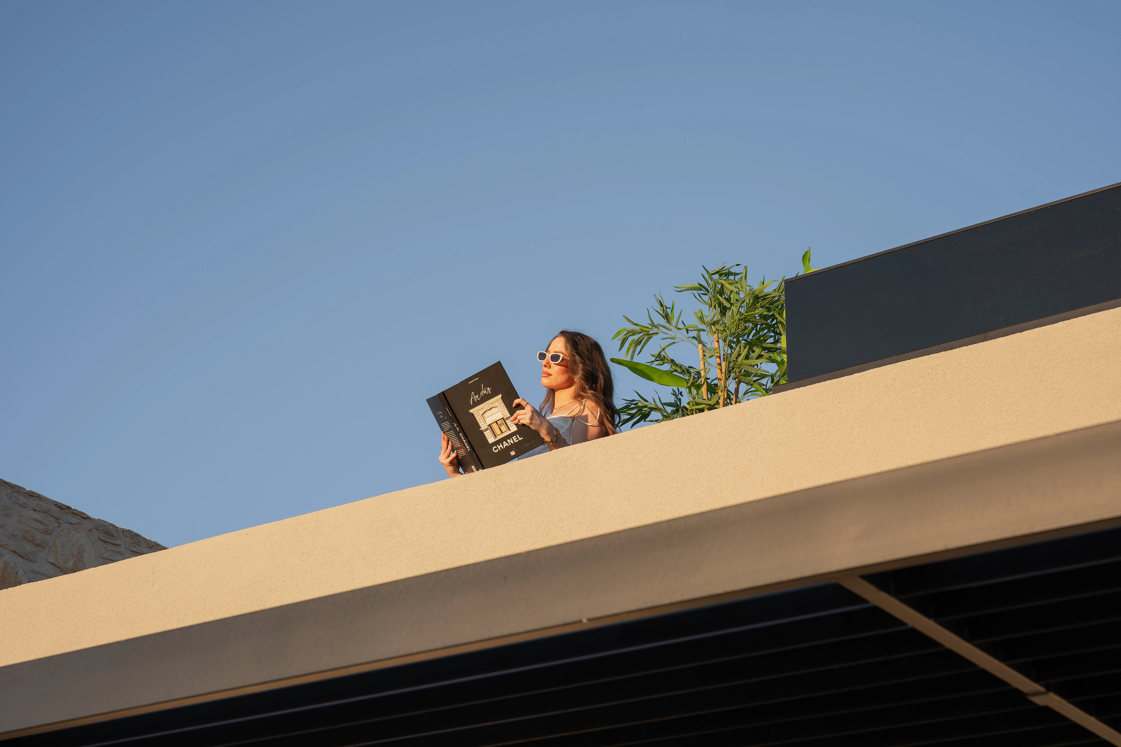 A guest reading on Left Crete's private upper terrace