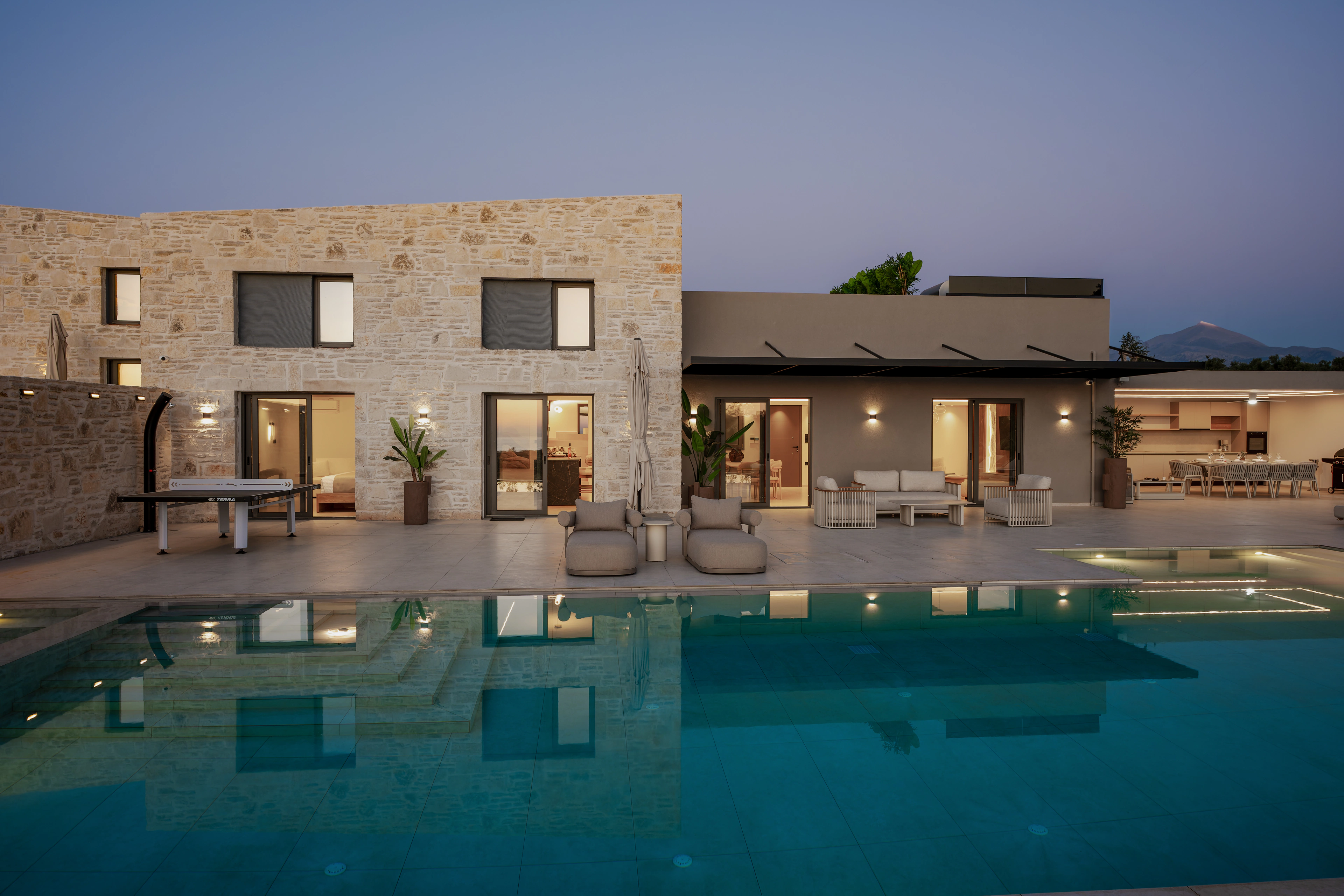 Left Crete pool and outdoor living space at blue hour