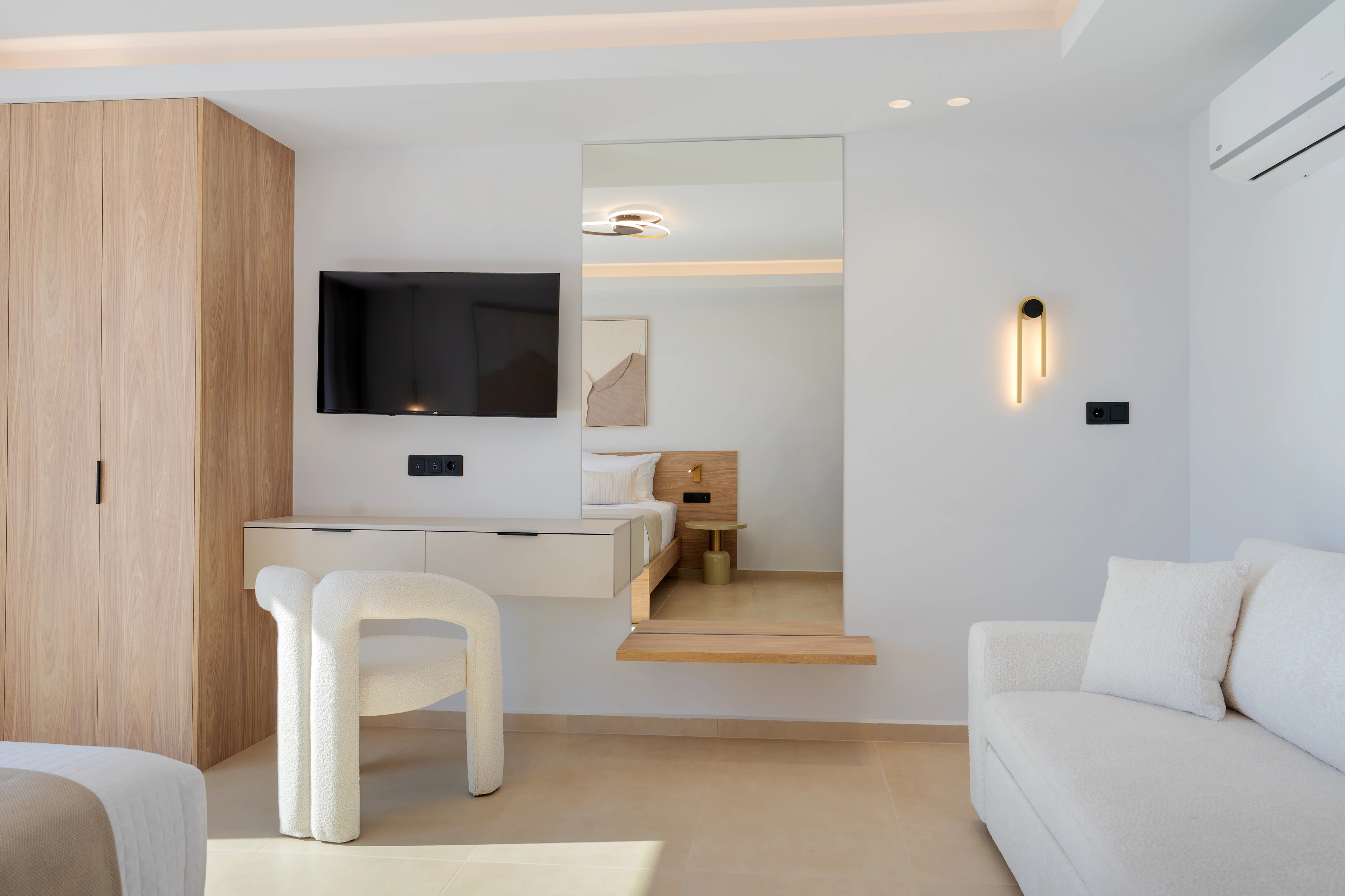 Left Crete bedroom 05 with two single beds, television and timber wardrobe