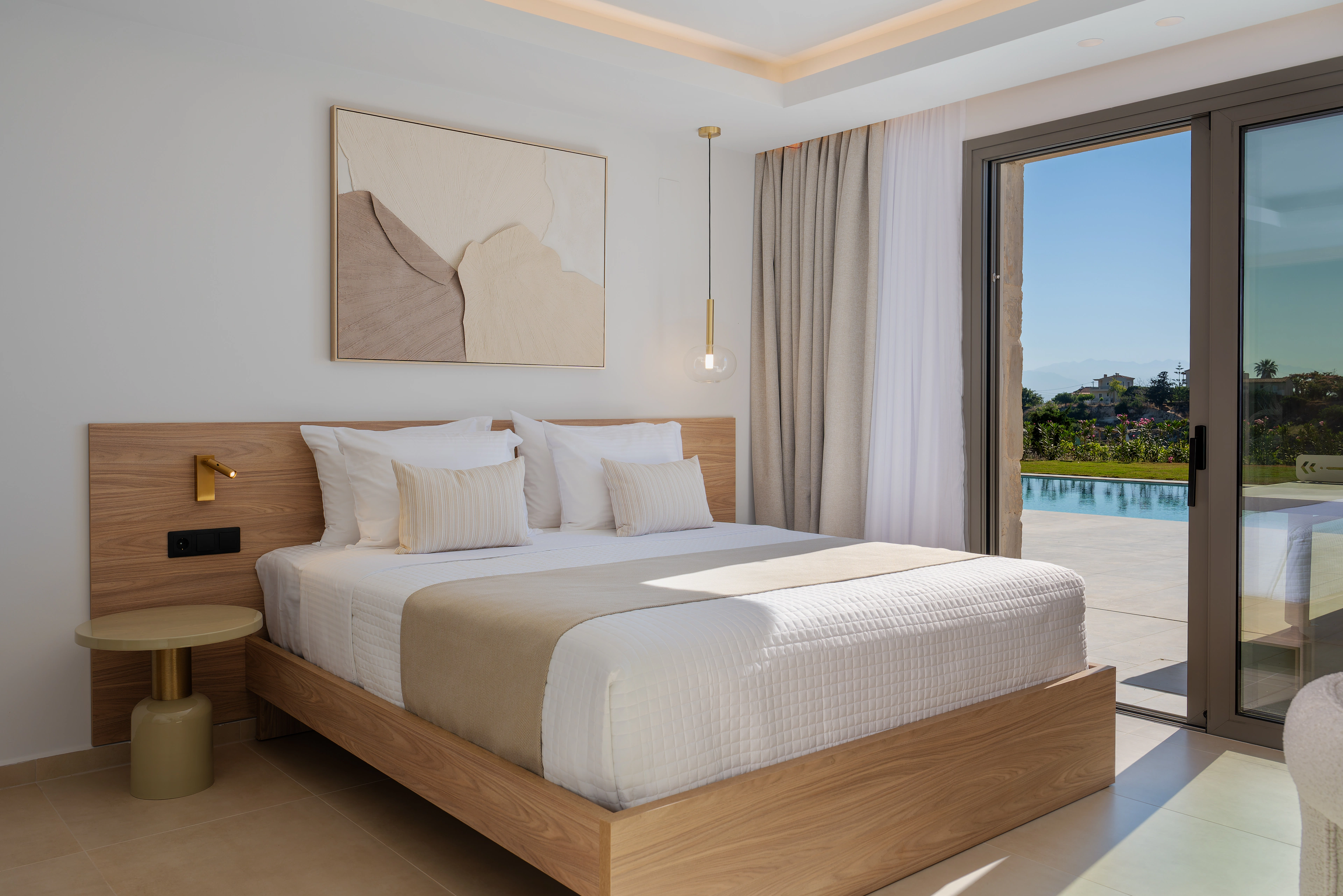 Two single beds in Left Crete bedroom 05 with a garden view