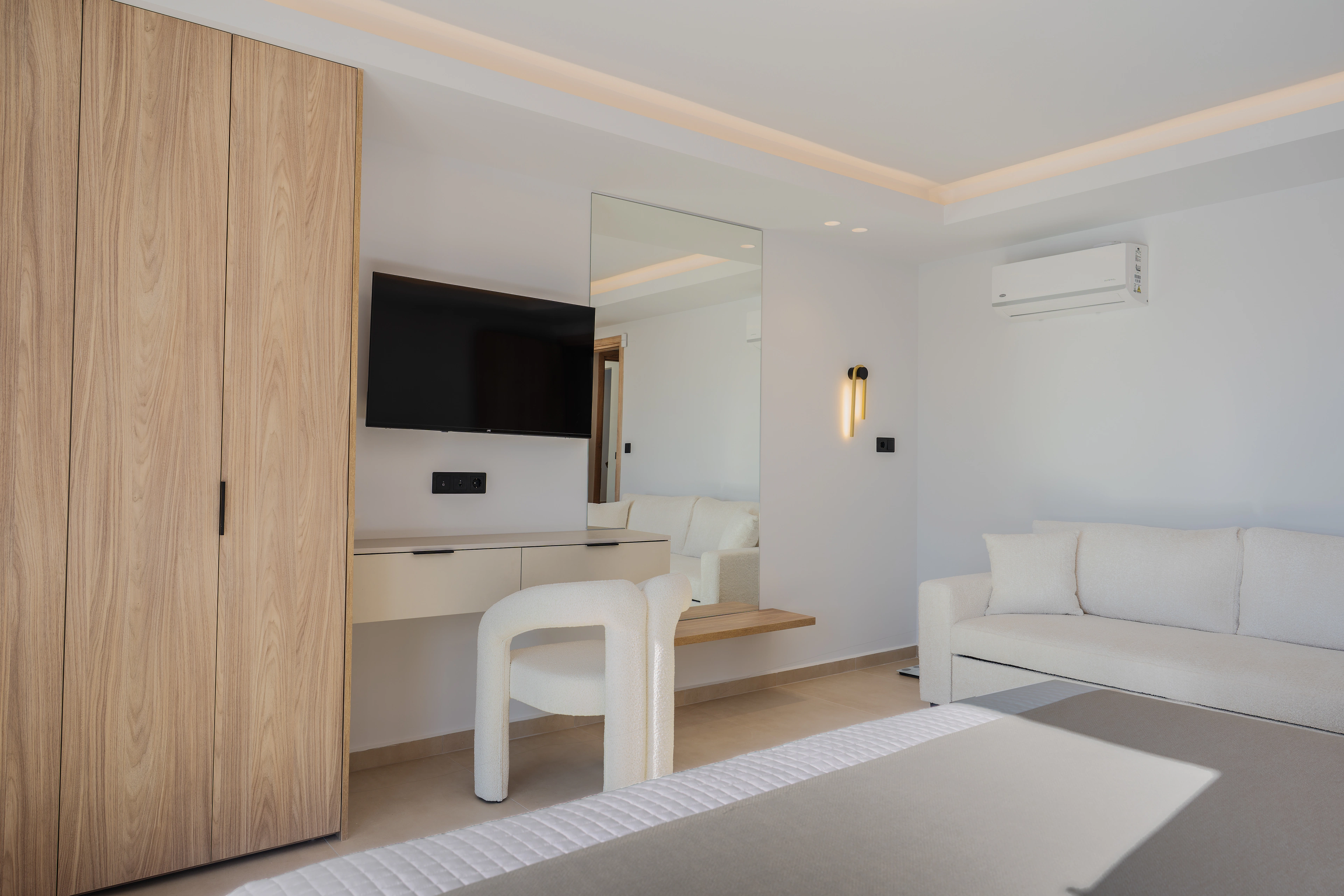 Wide view of Left Crete bedroom 05 with two single beds and television