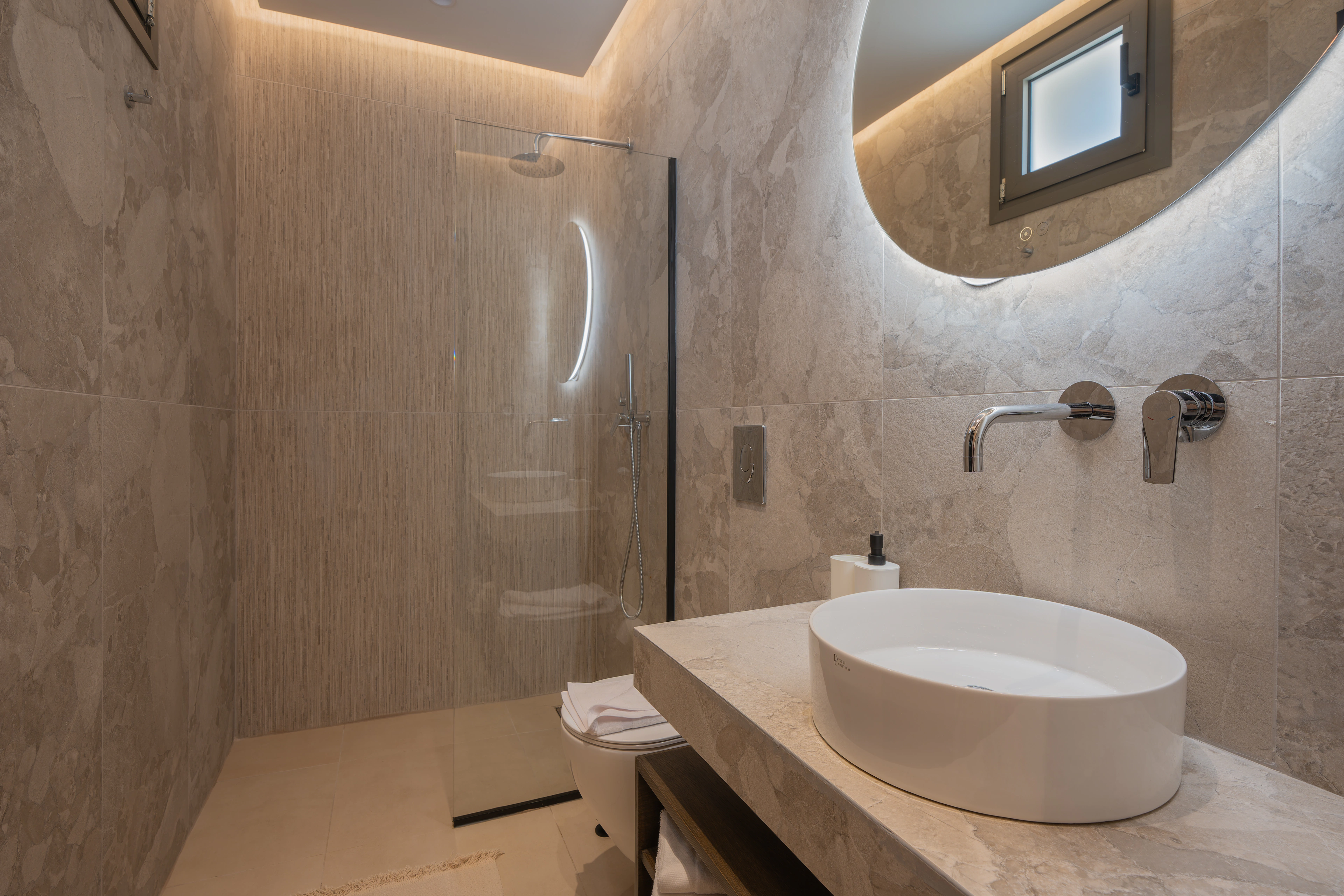 Private en-suite bathroom for Right Crete bedroom 01 with stone vanity and shower