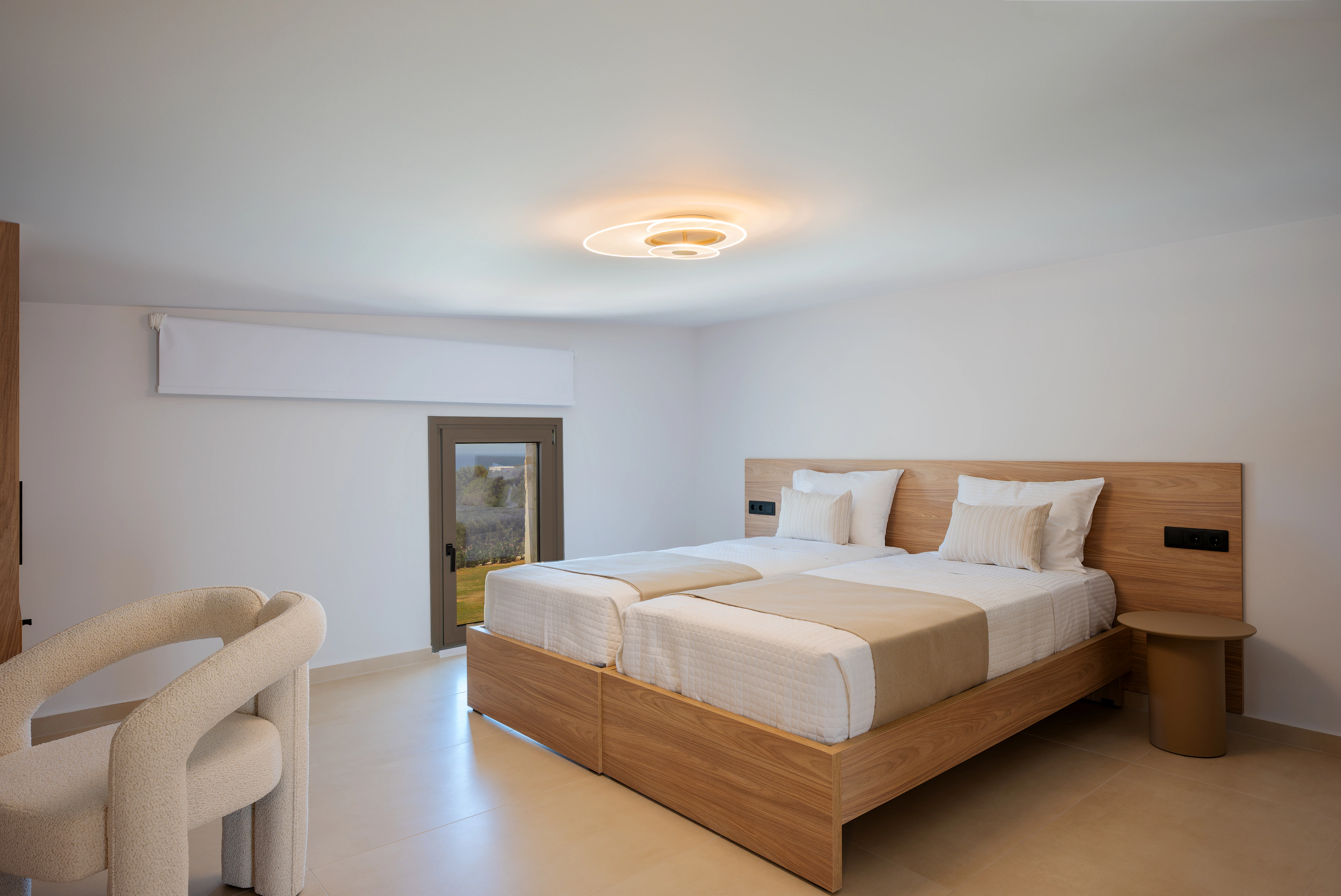 King-size bed and garden doorway in Right Crete bedroom 03