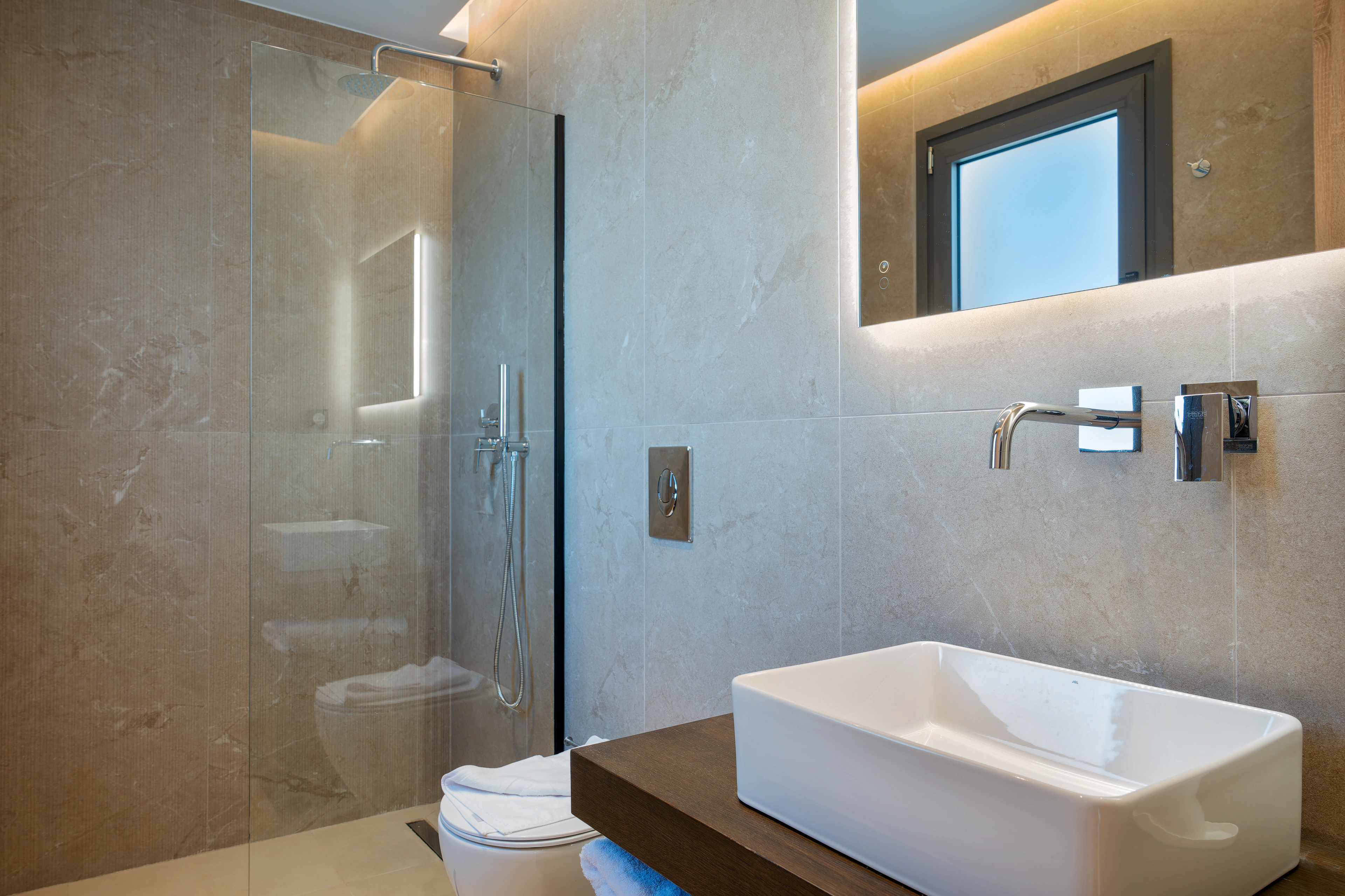 Private en-suite bathroom for Right Crete bedroom 05 with stone vanity and walk-in shower
