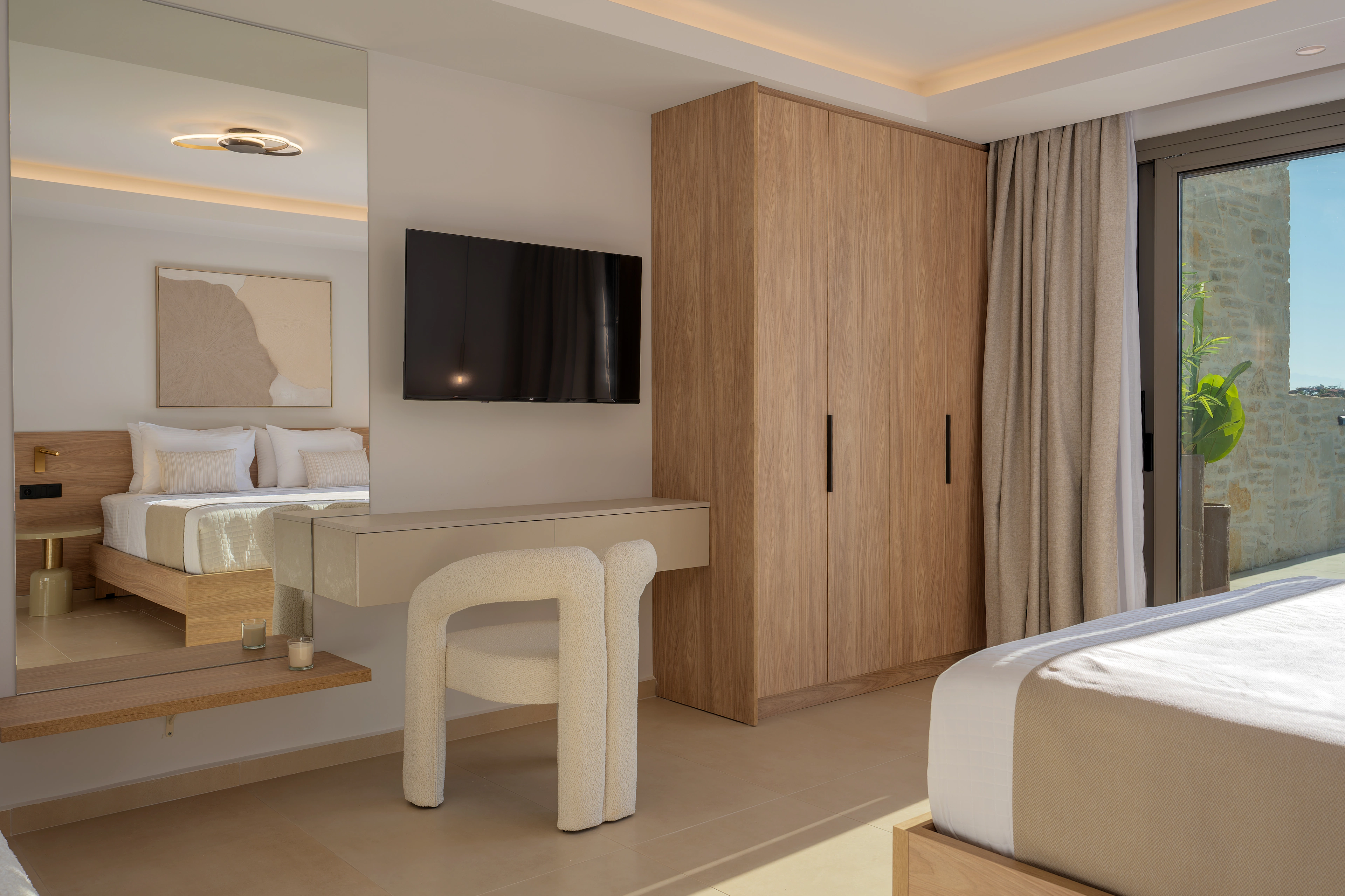 Right Crete bedroom 05 with two single beds, television and timber wardrobe