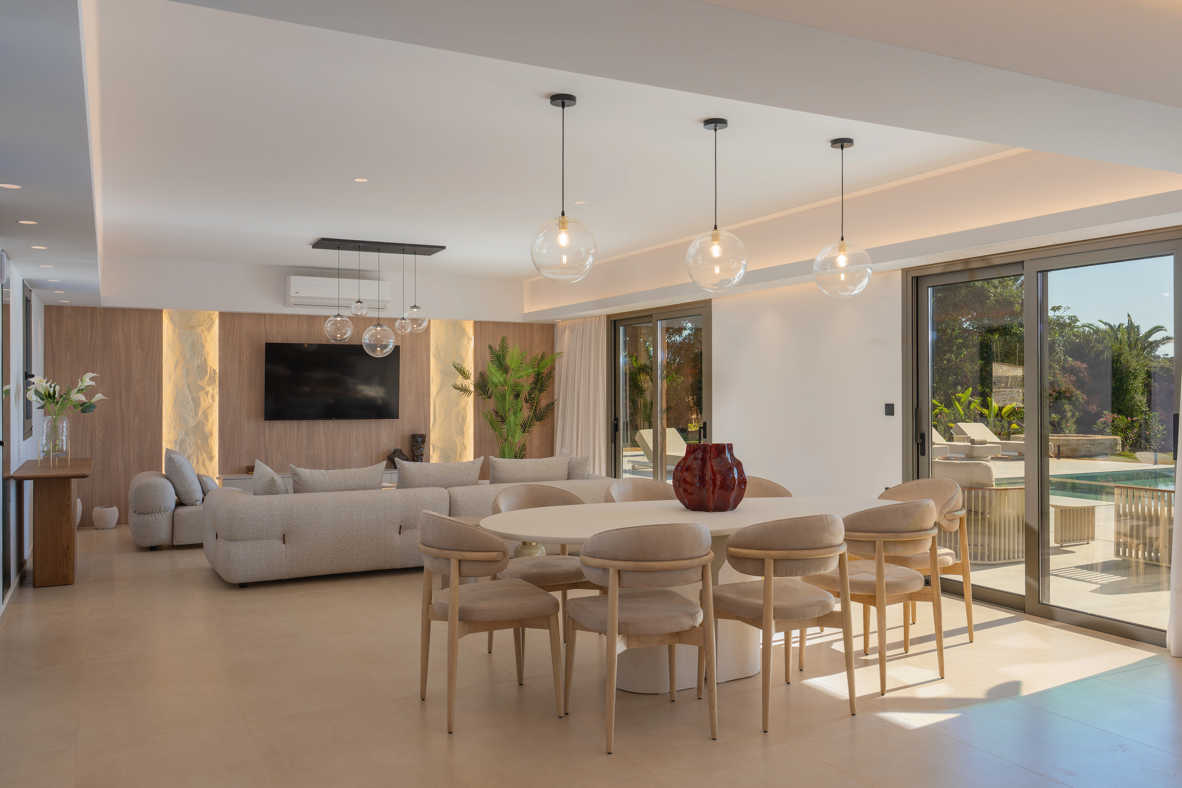 Left Crete's open-plan dining and lounge facing the pool terrace