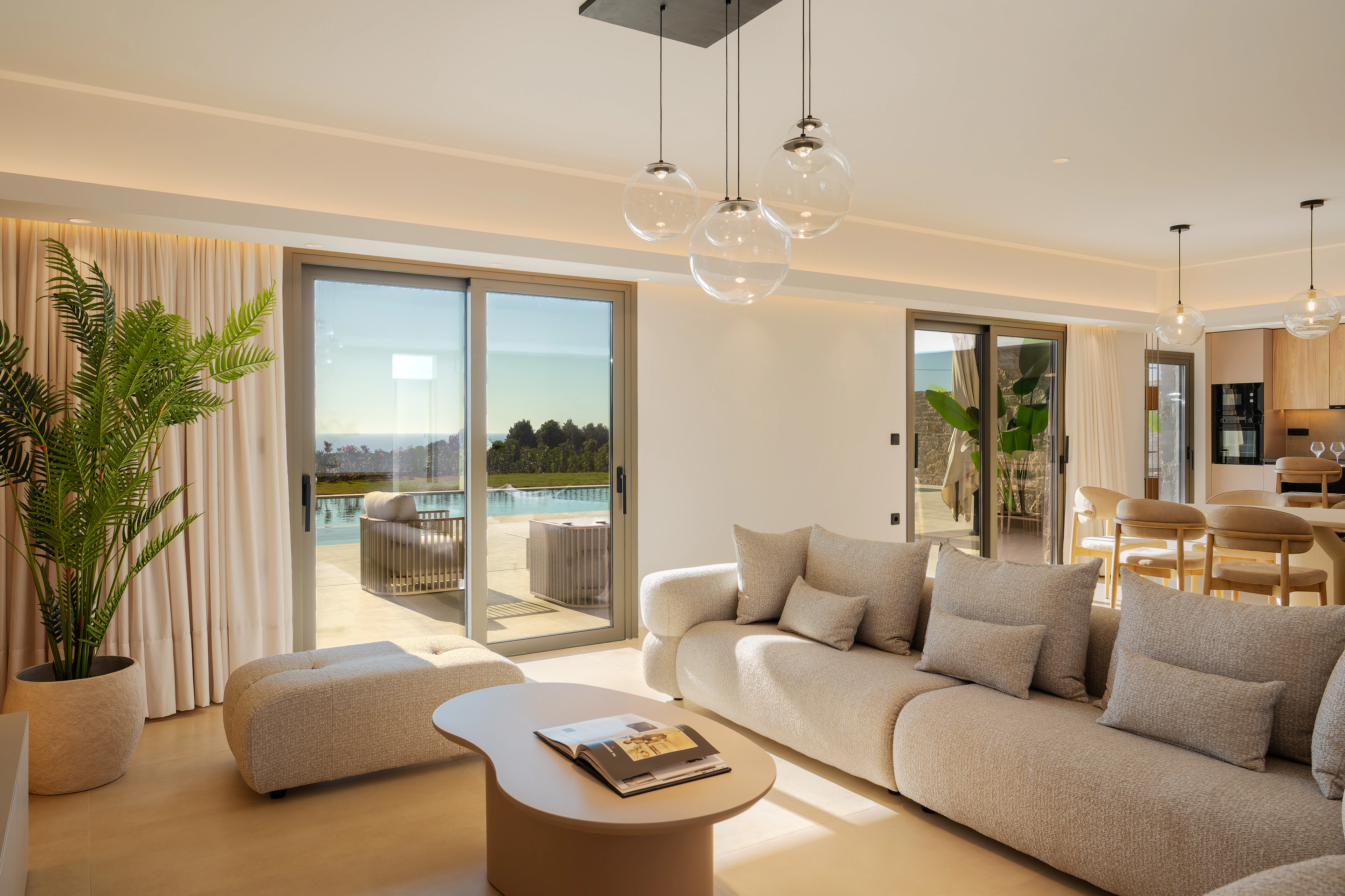 Left Crete's living room with wide doors opening to the pool