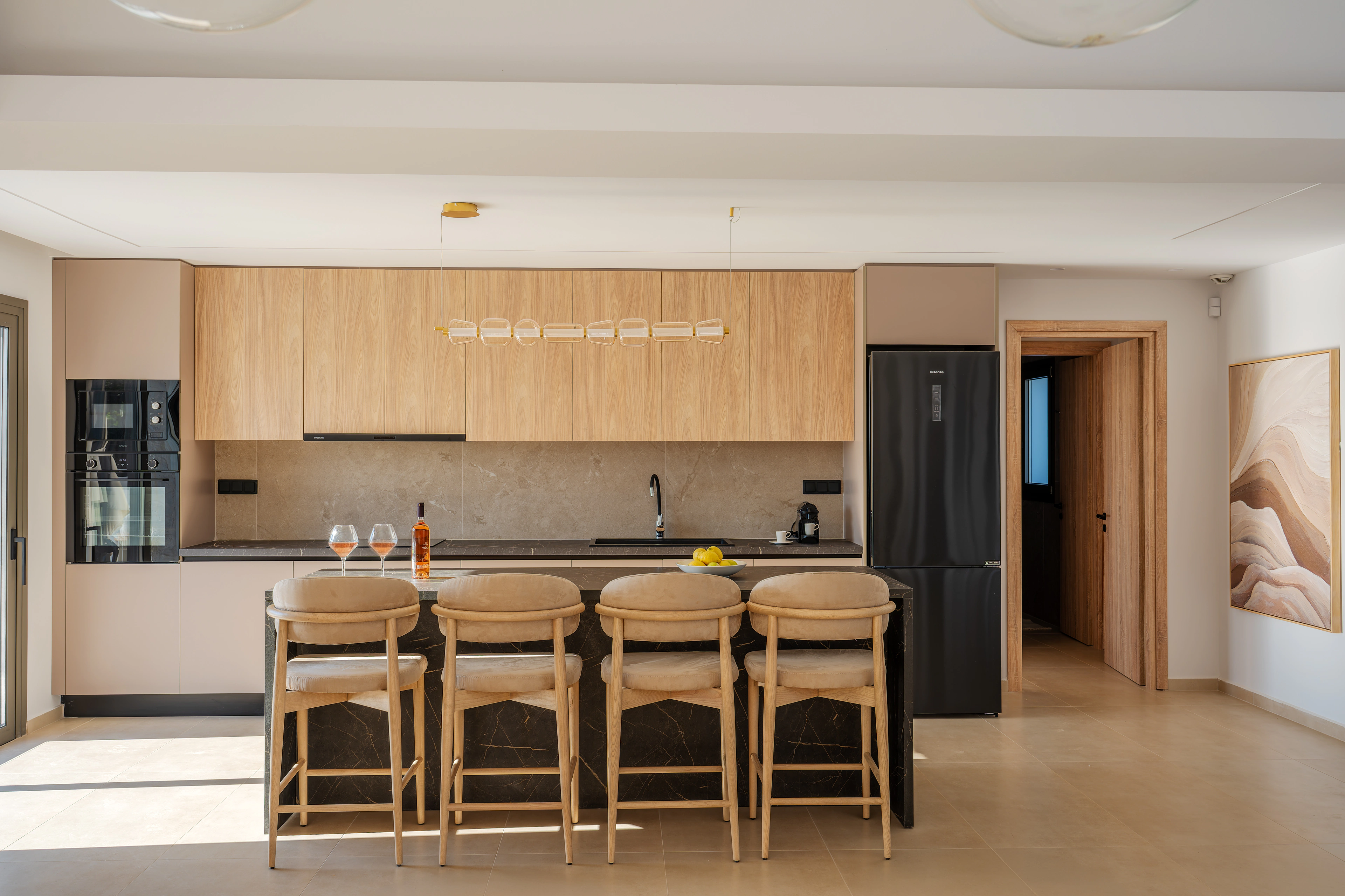 Front view of Left Crete's kitchen and breakfast island