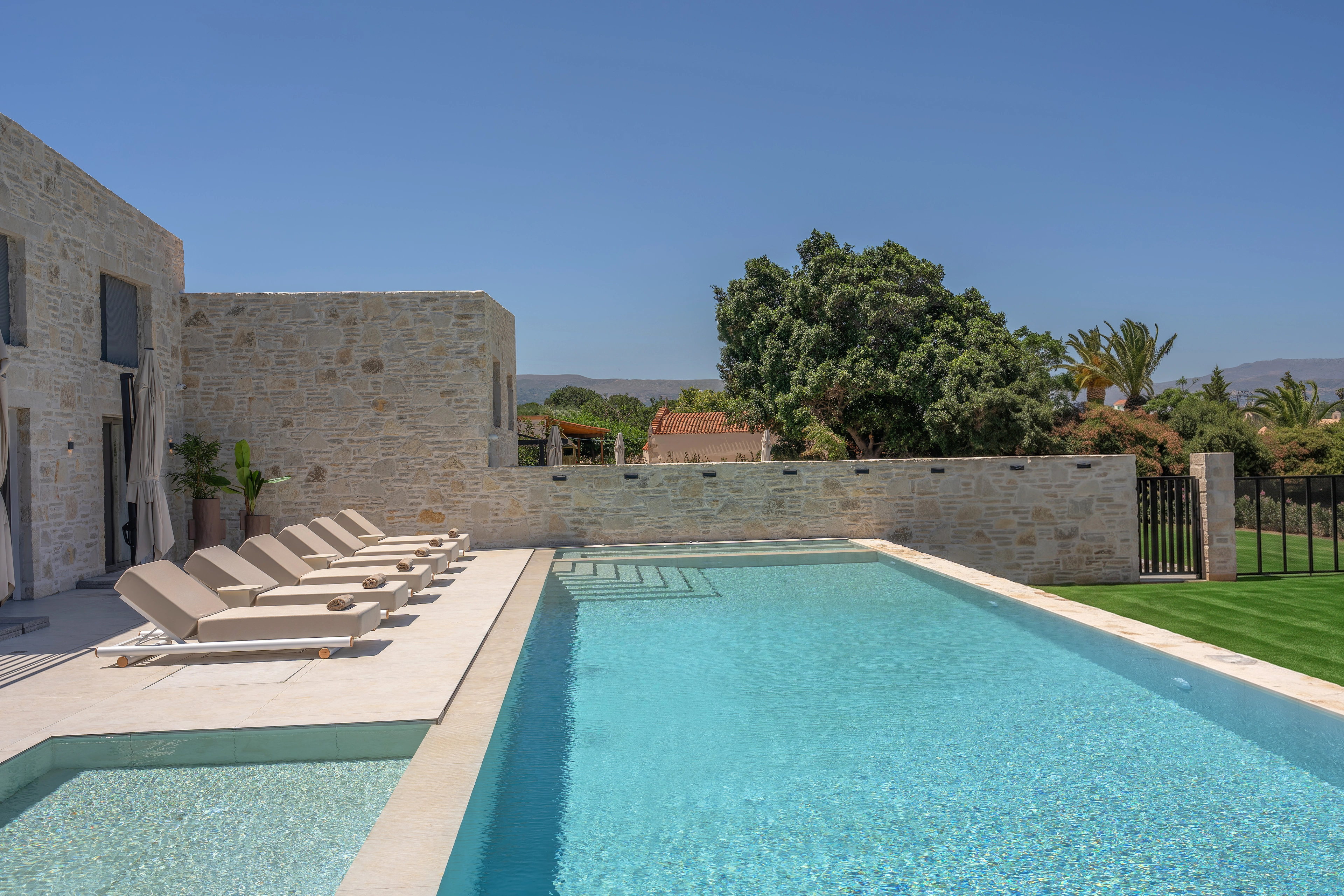 Right Crete loungers and private pool with an open sea horizon