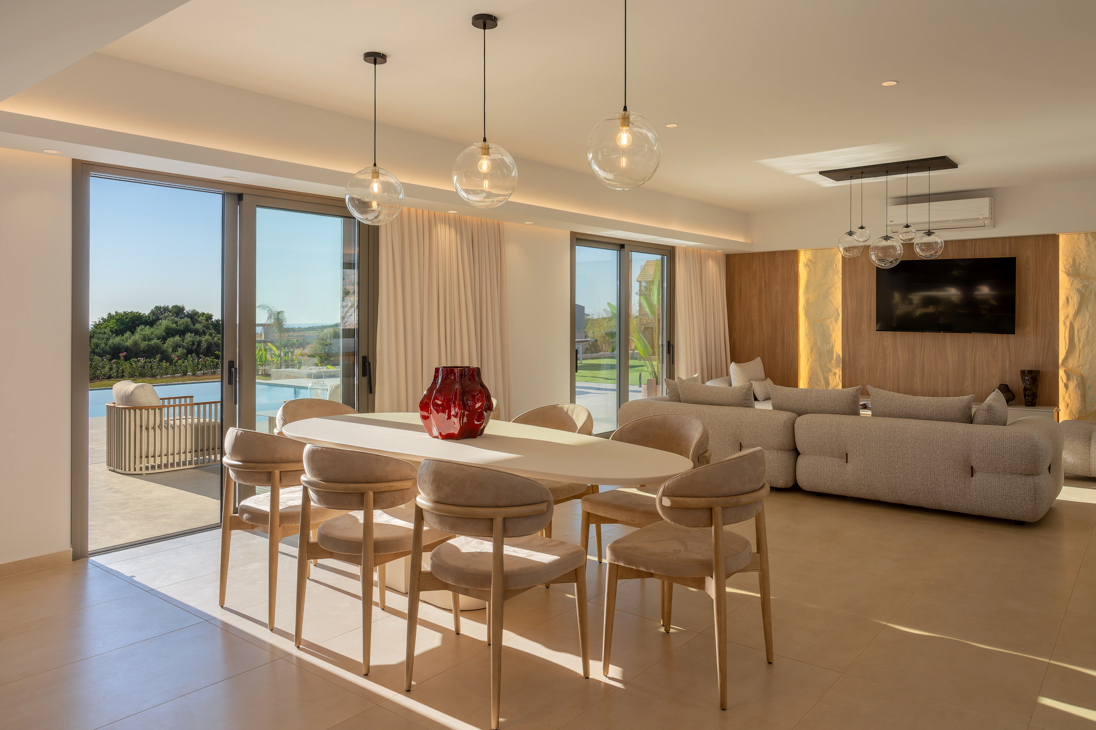 Right Crete's open-plan dining and lounge facing the pool terrace